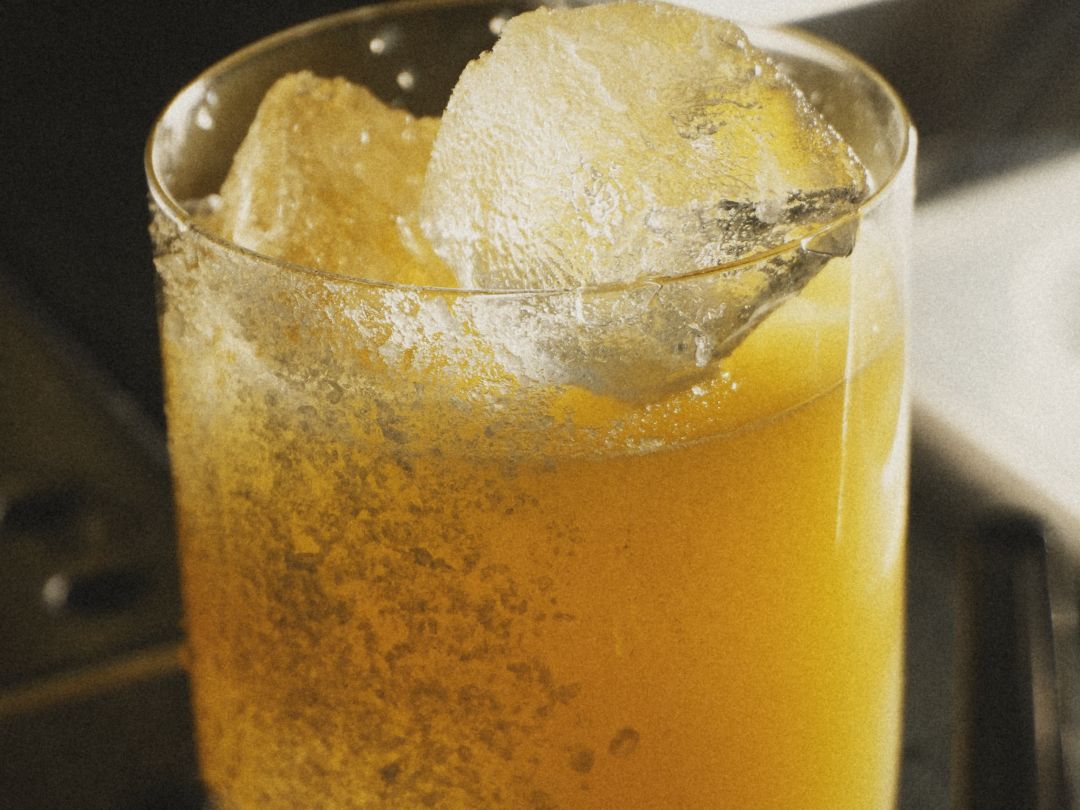 Amber highball over crushed ice
