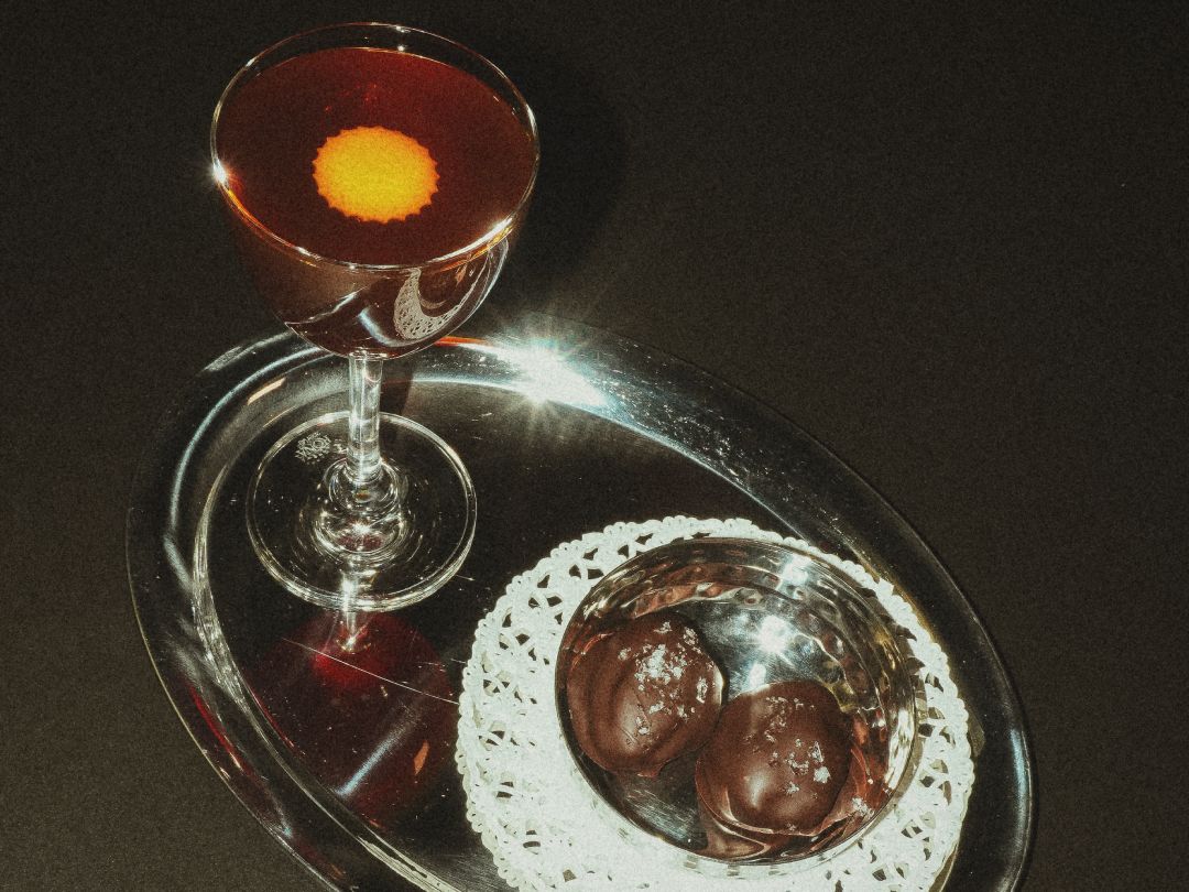 Stirred cocktail with chocolate truffles